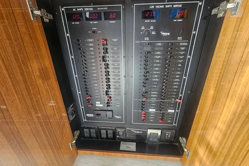 Team Turbo Yacht Photos Pics Electrical panel of a 2013 Viking 42 Convertible boat, showcasing AC and low voltage services.