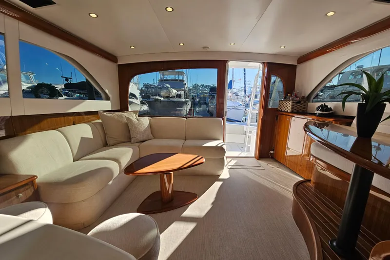 Team Turbo Yacht Photos Pics Luxurious interior of 2013 Viking 42 Convertible yacht with elegant seating and wooden accents.