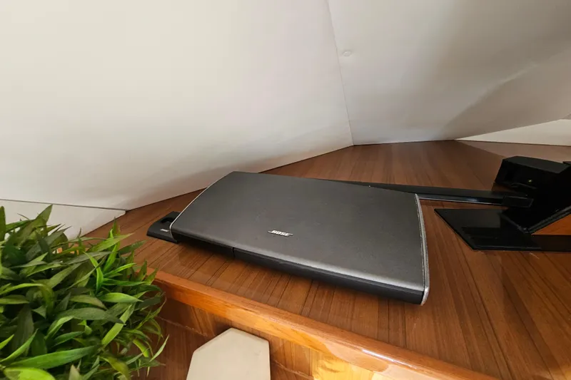 Team Turbo Yacht Photos Pics Bose sound system on 2013 Viking 42 Convertible yacht with wooden interior and plant decor.