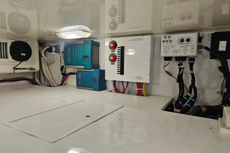 Team Turbo Yacht Photos Pics Engine room of 2013 Viking 42 Convertible with electrical panels and wiring.