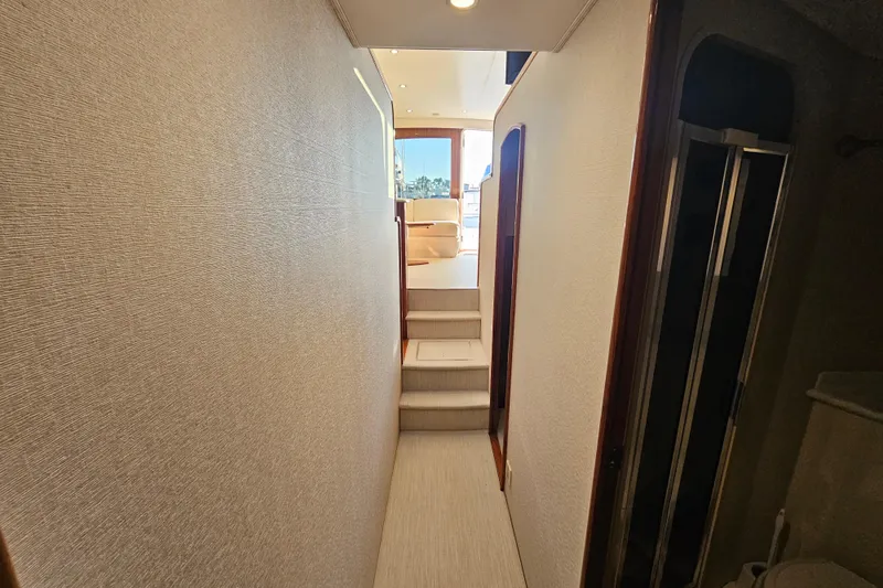 Team Turbo Yacht Photos Pics Hallway inside 2013 Viking 42 Convertible yacht, featuring stairs and modern interior design.