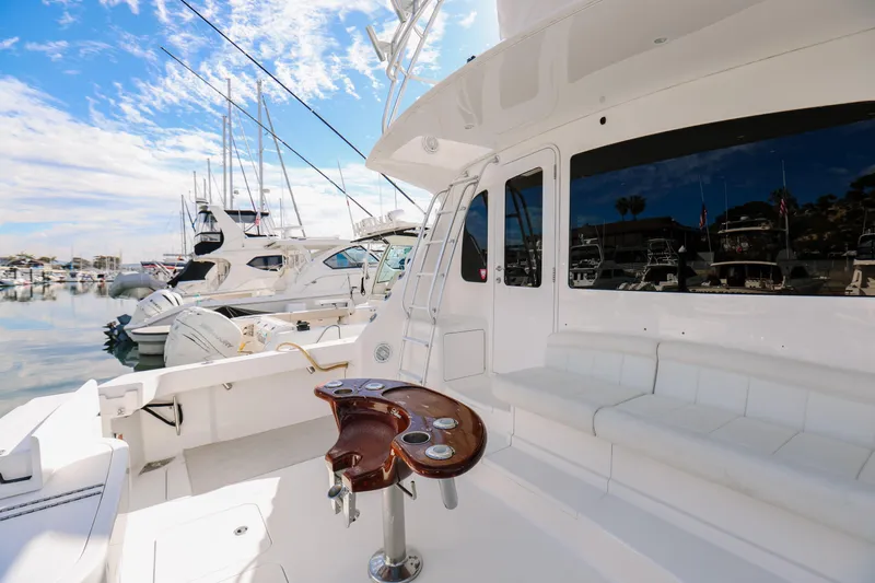 Team Turbo Yacht Photos Pics 2013 Viking 42 Convertible yacht docked in marina, featuring sleek white design and fishing station.