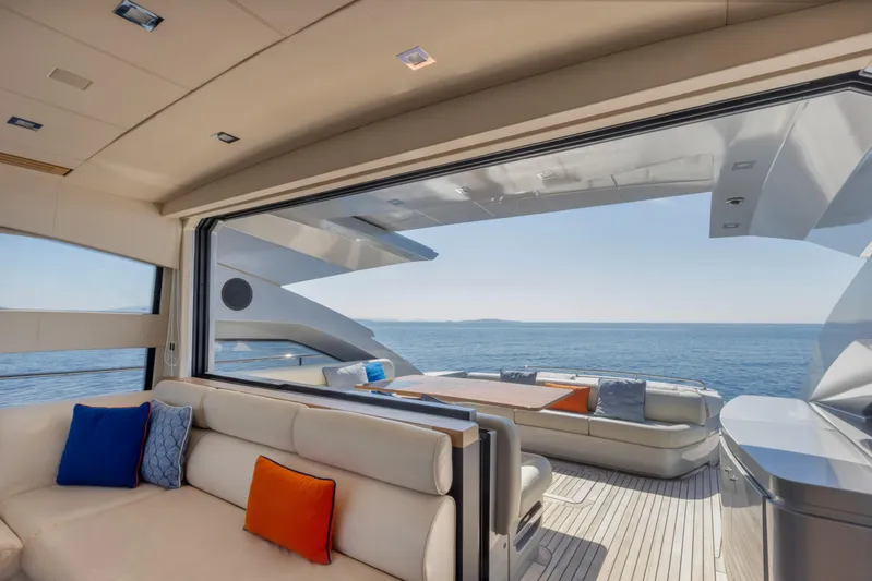  Yacht Photos Pics Luxurious interior of 2009 Pershing 64 yacht with ocean view and plush seating.