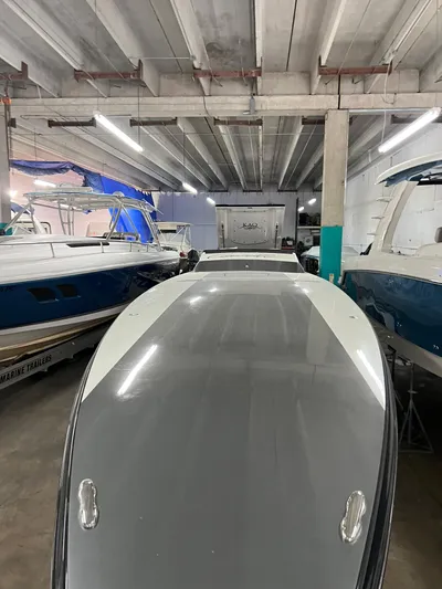  Yacht Photos Pics 2012 Cigarette 50' Marauder AMG boat in storage, surrounded by other vessels.