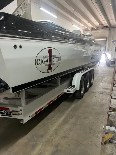  Yacht Photos Pics 2012 Cigarette 50' Marauder AMG boat on trailer in indoor storage facility.
