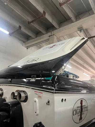  Yacht Photos Pics 2012 Cigarette 50' Marauder AMG boat in a garage, showcasing its sleek design.