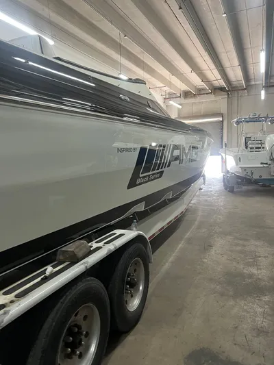  Yacht Photos Pics 2012 Cigarette 50' Marauder AMG boat in a garage, side view.
