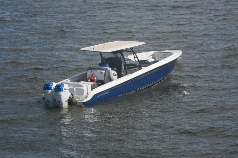  Yacht Photos Pics 2018 Nor-Tech 340 Sport Center Console boat on water, featuring dual Mercury engines.