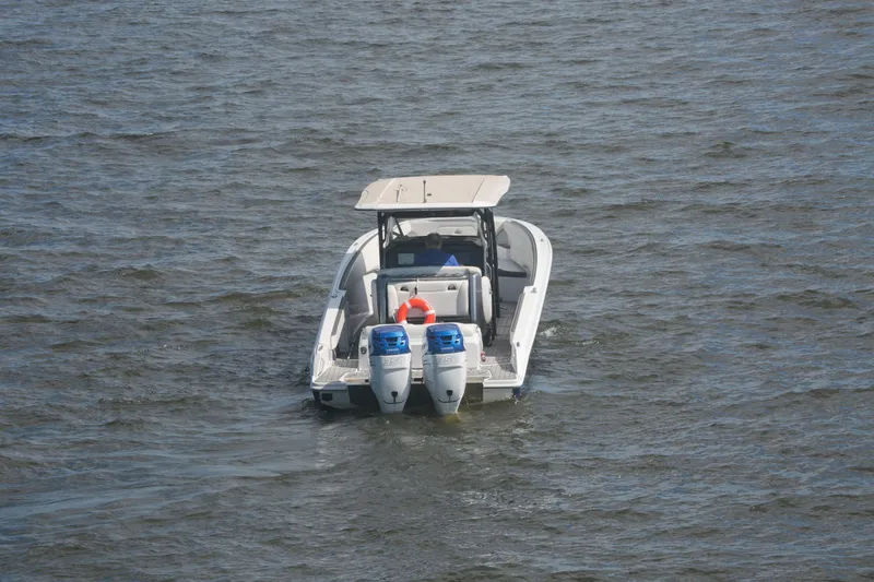 Yacht Photos Pics 2018 Nor-Tech 340 Sport Center Console boat on open water, rear view.