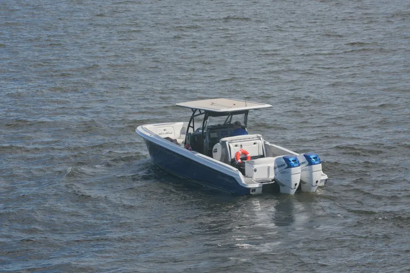  Yacht Photos Pics 2018 Nor-Tech 340 Sport Center Console boat on open water with dual engines.