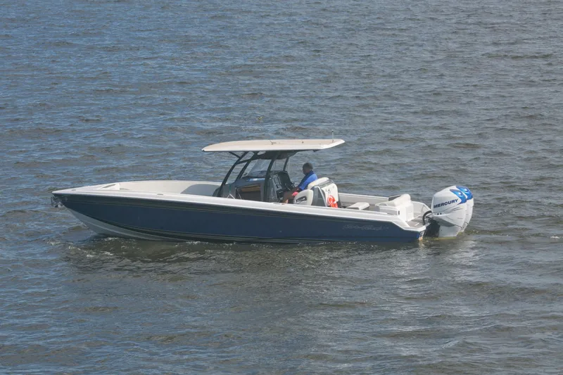  Yacht Photos Pics 2018 Nor-Tech 340 Sport Center Console boat cruising on open water.