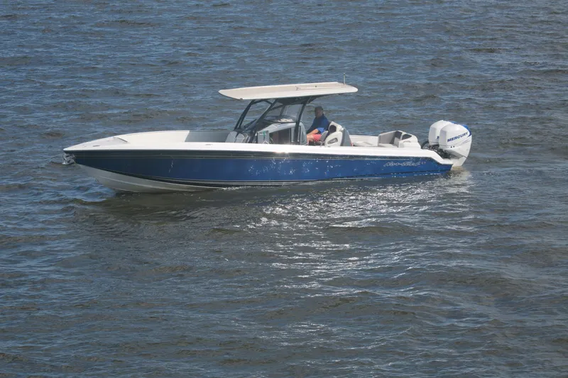  Yacht Photos Pics 2018 Nor-Tech 340 Sport Center Console boat cruising on open water.