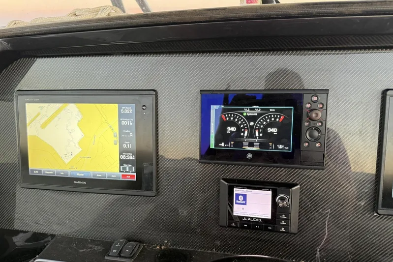  Yacht Photos Pics Dashboard of 2018 Nor-Tech 340 Sport Center Console with navigation and audio displays.