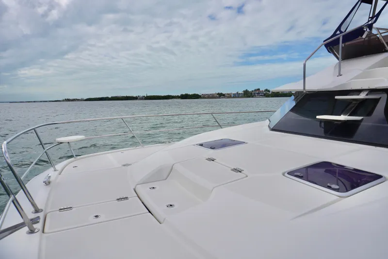 Sandals Yacht Photos Pics 2017 Aquila 44 Yacht deck with ocean view under cloudy sky.