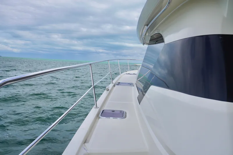 Sandals Yacht Photos Pics Side view of 2017 Aquila 44 Yacht on open sea under cloudy sky.