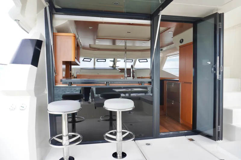 Sandals Yacht Photos Pics Interior view of 2017 Aquila 44 Yacht with modern seating and kitchen area.