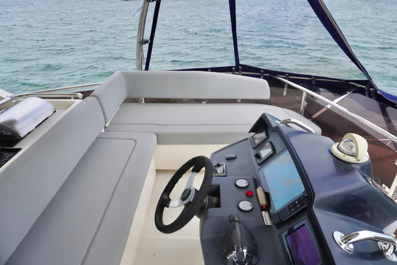 Sandals Yacht Photos Pics 2017 Aquila 44 Yacht helm with navigation controls and seating, overlooking the ocean.