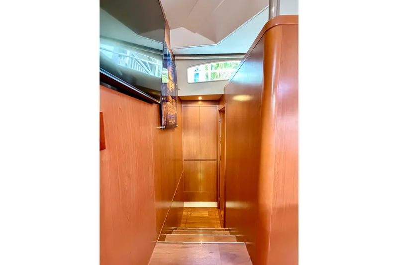 Sandals Yacht Photos Pics Interior hallway of 2017 Aquila 44 Yacht with wooden paneling and modern design.