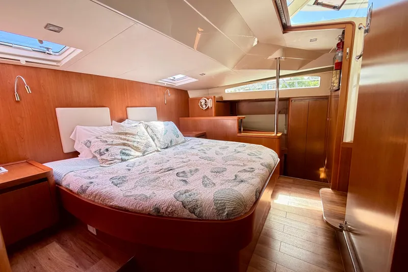 Sandals Yacht Photos Pics Luxurious 2017 Aquila 44 Yacht bedroom with wood paneling and skylights.