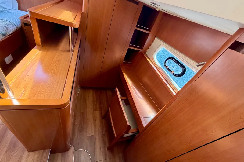 Sandals Yacht Photos Pics Interior of 2017 Aquila 44 Yacht with wooden cabinetry and window view.