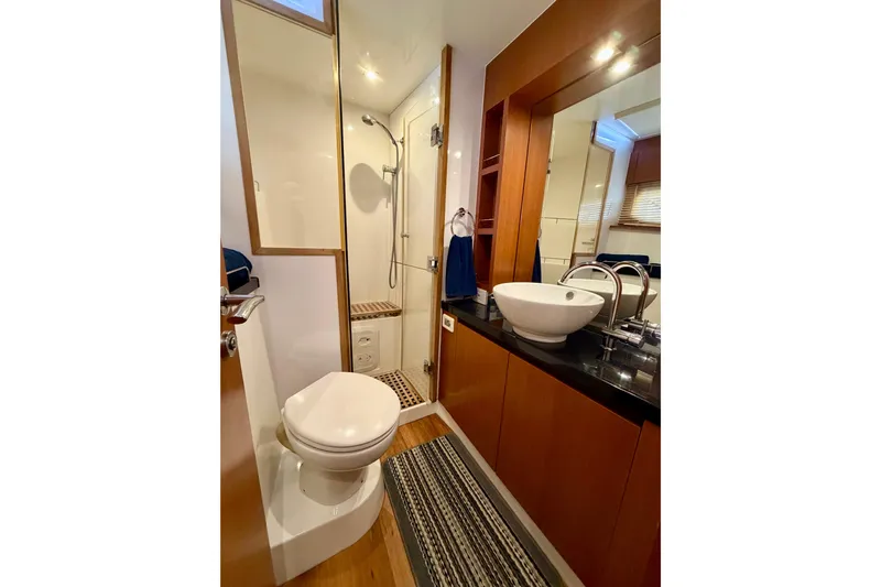 Sandals Yacht Photos Pics Luxurious bathroom in 2017 Aquila 44 Yacht with modern fixtures and elegant design.