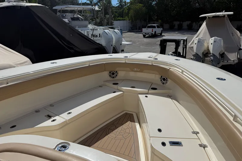  Yacht Photos Pics 2022 Scout 355 LXF boat interior with seating and storage compartments.