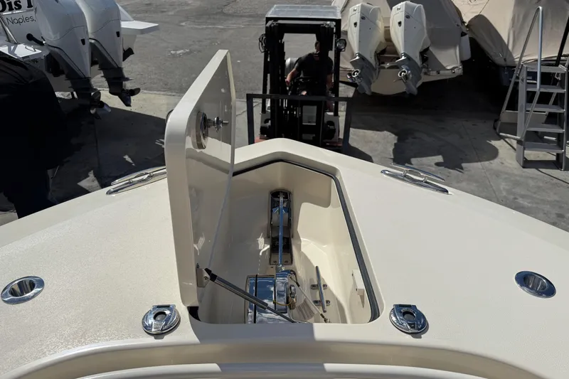  Yacht Photos Pics 2022 Scout 355 LXF boat anchor compartment with open hatch, docked at marina.