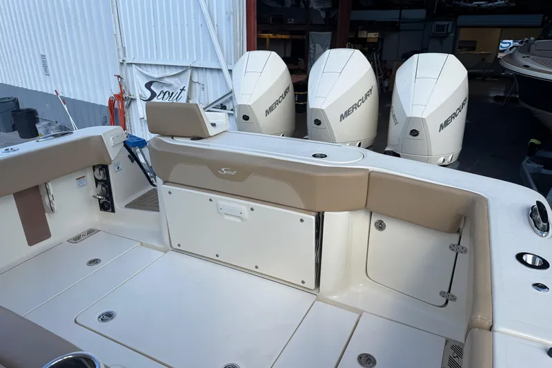  Yacht Photos Pics 2022 Scout 355 LXF boat with Mercury engines in a marina setting.