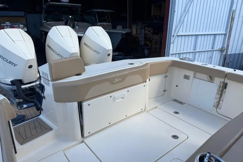  Yacht Photos Pics 2022 Scout 355 LXF boat with triple Mercury engines, spacious deck, and sleek design.