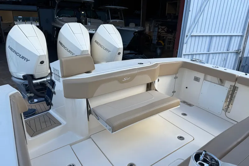  Yacht Photos Pics 2022 Scout 355 LXF boat with triple Mercury engines and beige seating.