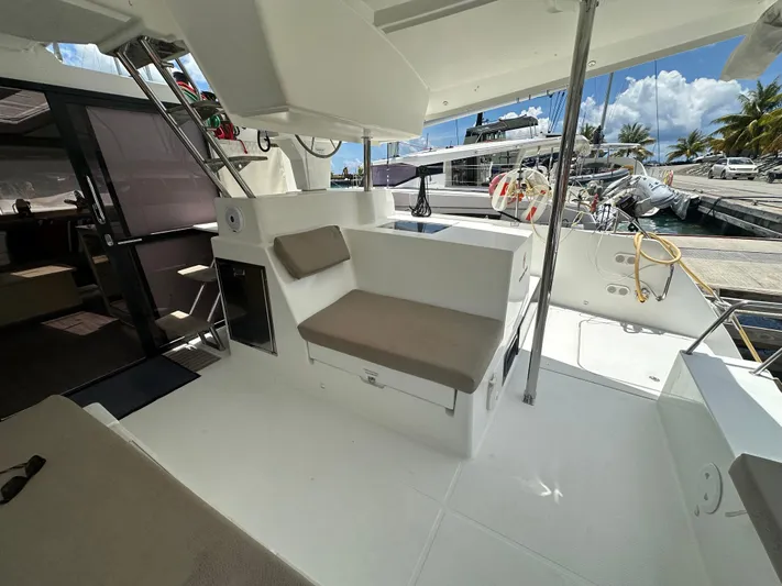 Goin' Coastal Yacht Photos Pics 2018 Fountaine Pajot Helia 44 Evolution yacht interior with seating area and marina view.