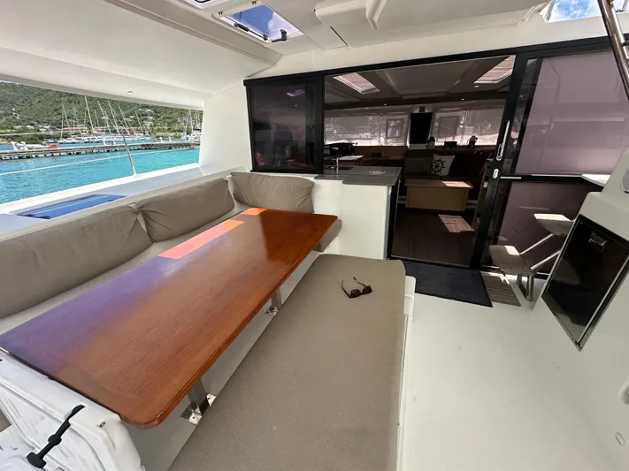 Goin' Coastal Yacht Photos Pics Spacious 2018 Fountaine Pajot Helia 44 Evolution yacht interior with seating and dining area.