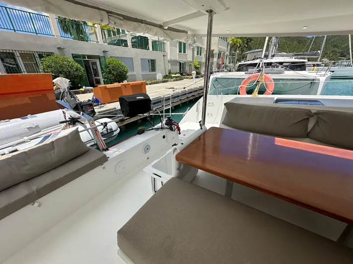 Goin' Coastal Yacht Photos Pics 2018 Fountaine Pajot Helia 44 Evolution catamaran with outdoor seating and dining area.