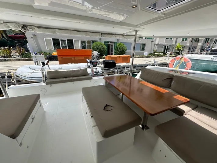 Goin' Coastal Yacht Photos Pics Spacious deck of 2018 Fountaine Pajot Helia 44 Evolution catamaran with seating and table.