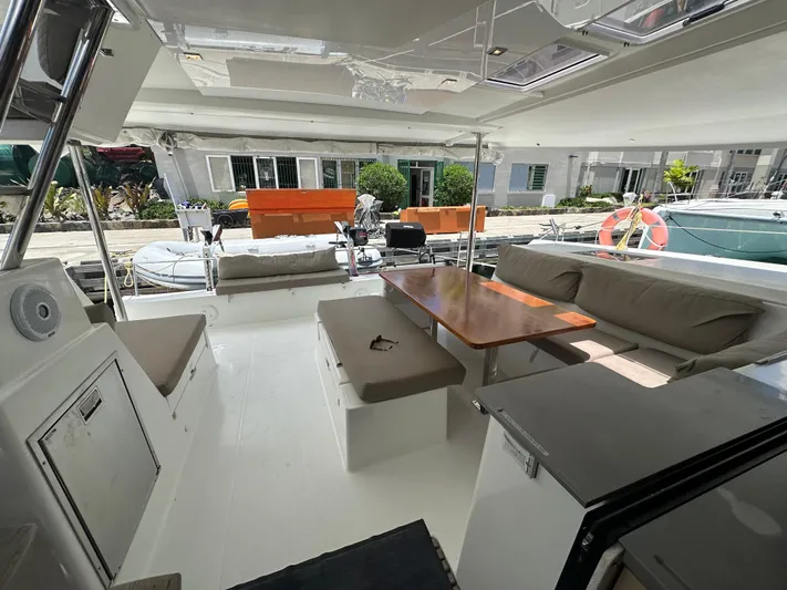 Goin' Coastal Yacht Photos Pics Spacious 2018 Fountaine Pajot Helia 44 Evolution yacht interior with comfortable seating and dining area.