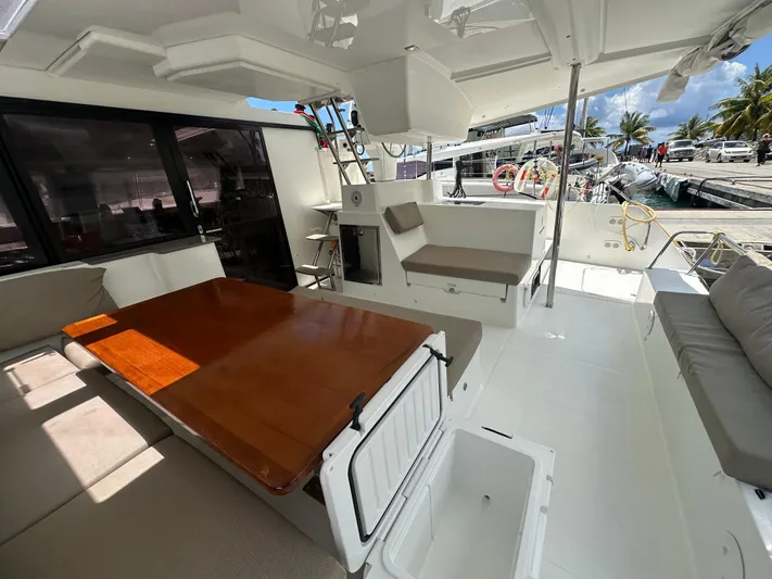 Goin' Coastal Yacht Photos Pics Spacious deck of 2018 Fountaine Pajot Helia 44 Evolution catamaran with seating and table.