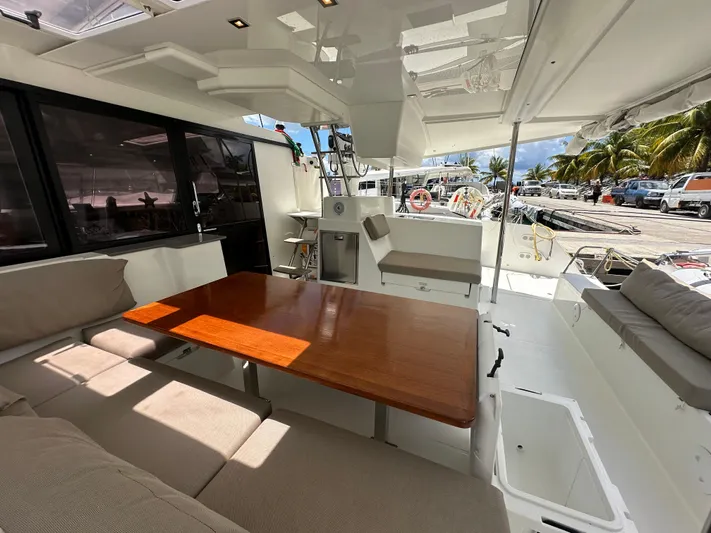 Goin' Coastal Yacht Photos Pics Spacious deck of 2018 Fountaine Pajot Helia 44 Evolution catamaran with seating and table.