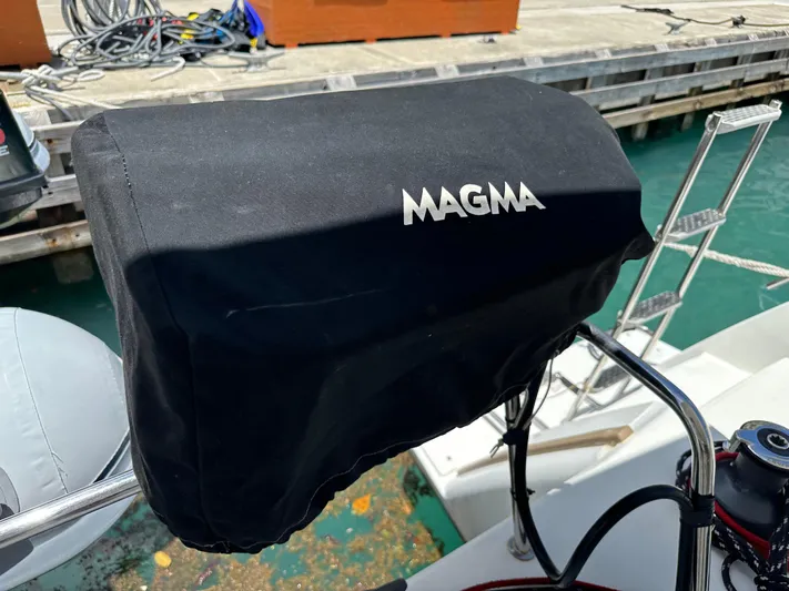 Goin' Coastal Yacht Photos Pics Magma grill cover on 2018 Fountaine Pajot Helia 44 Evolution yacht at dock.