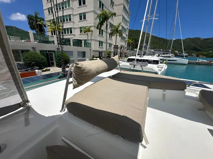 Goin' Coastal Yacht Photos Pics 2018 Fountaine Pajot Helia 44 Evolution catamaran docked in a scenic marina.