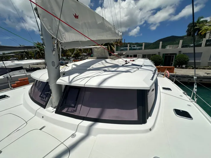 Goin' Coastal Yacht Photos Pics 2018 Fountaine Pajot Helia 44 Evolution catamaran docked under a sunny sky.