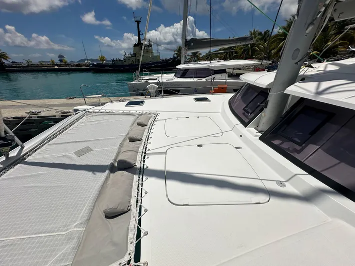 Goin' Coastal Yacht Photos Pics 2018 Fountaine Pajot Helia 44 Evolution catamaran docked in a sunny marina.