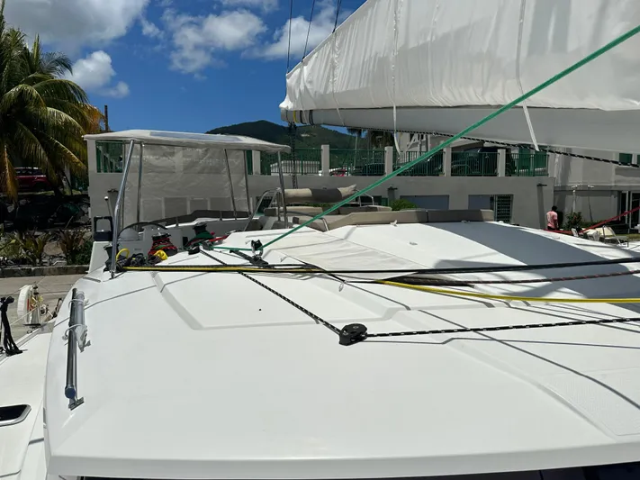 Goin' Coastal Yacht Photos Pics 2018 Fountaine Pajot Helia 44 Evolution catamaran docked under clear blue sky.