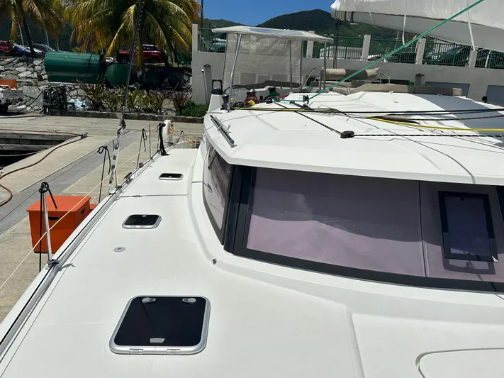 Goin' Coastal Yacht Photos Pics Fountaine Pajot Helia 44 Evolution catamaran docked, 2018 model, sunny marina setting.