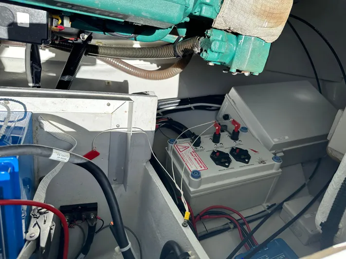 Goin' Coastal Yacht Photos Pics Engine compartment of 2018 Fountaine Pajot Helia 44 Evolution catamaran, showing battery and wiring.