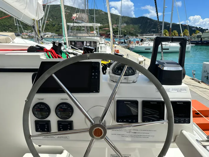 Goin' Coastal Yacht Photos Pics Helm of 2018 Fountaine Pajot Helia 44 Evolution catamaran docked at marina.
