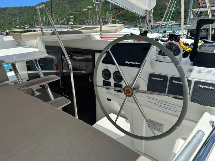 Goin' Coastal Yacht Photos Pics Helm of 2018 Fountaine Pajot Helia 44 Evolution catamaran with navigation instruments.