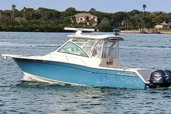 Rising Sun Yacht Photos Pics 2018 Grady-White Express 330 boat cruising on a scenic waterway.