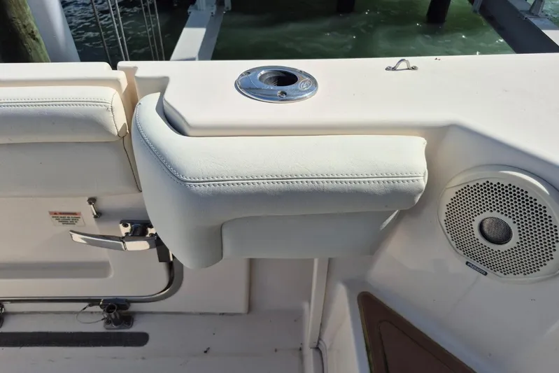 Rising Sun Yacht Photos Pics 2018 Grady-White Express 330 boat interior with cushioned seating and speaker.