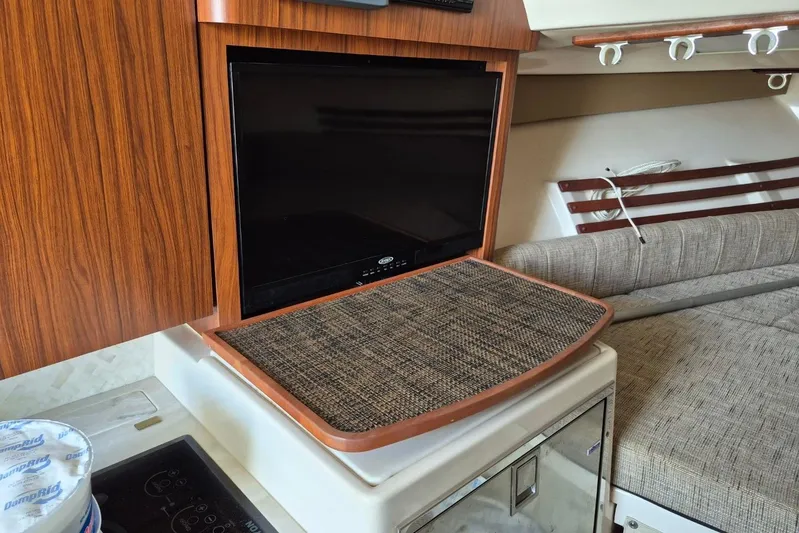 Rising Sun Yacht Photos Pics 2018 Grady-White Express 330 interior with TV and seating area.