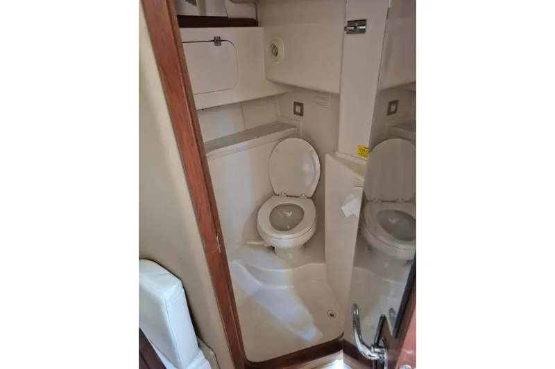 Rising Sun Yacht Photos Pics 2018 Grady-White Express 330 boat bathroom interior with toilet and storage.